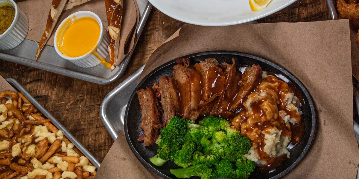 A shared table of Perfect SZN plates set for a group