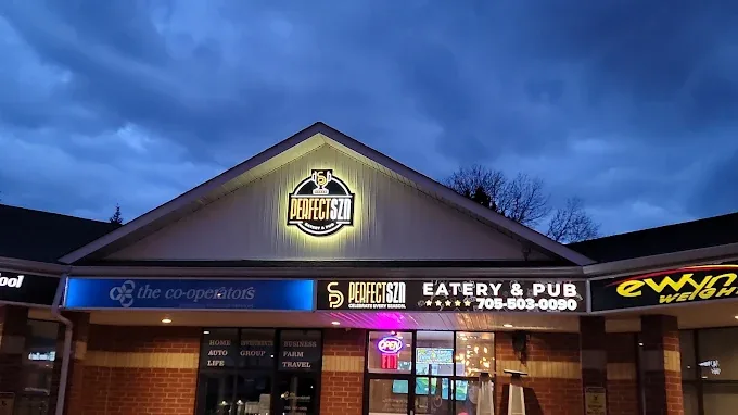 The Perfect SZN Barrie storefront at dusk under a blue sky